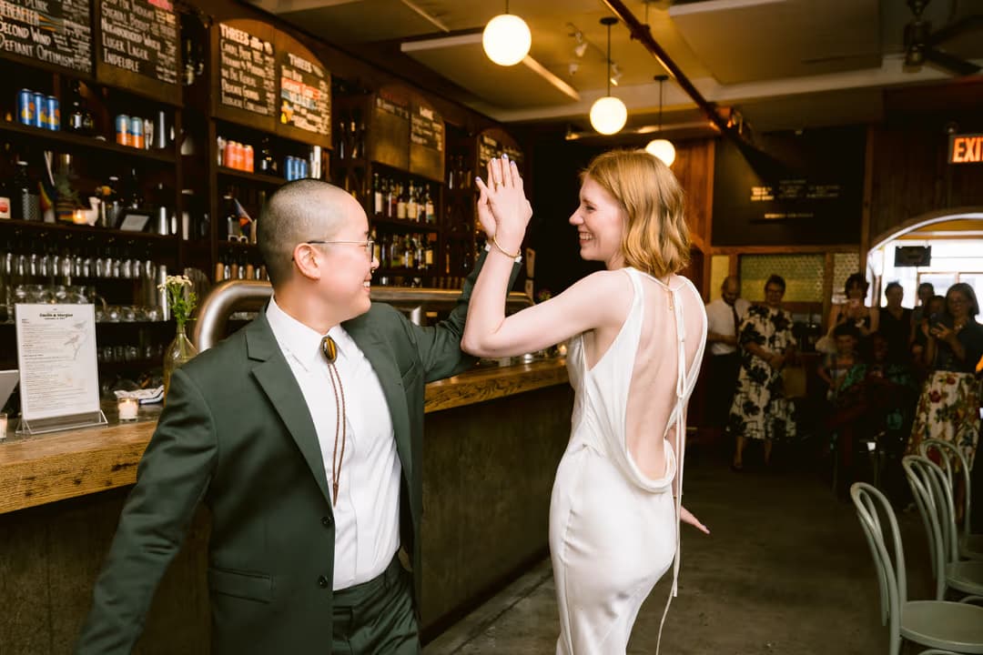 Couple celebrating with their wedding party